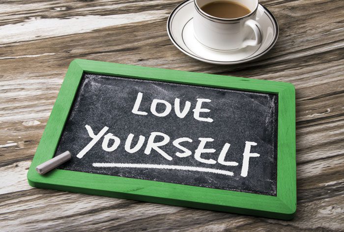 self-love, love yourself written on small chalk board