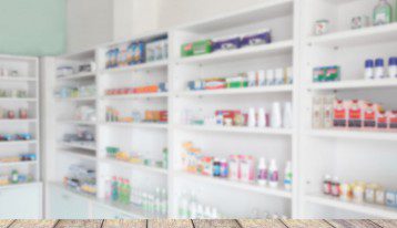 pharmacy shelves blurred