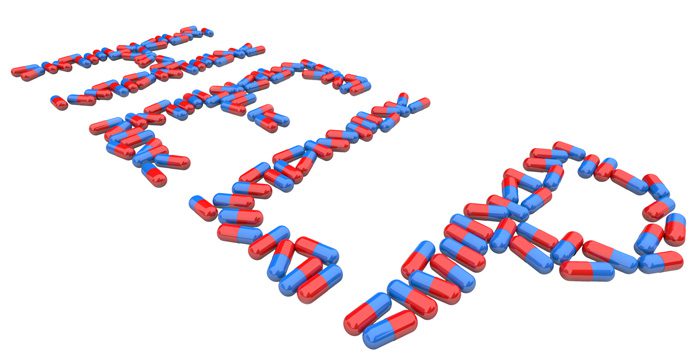 the word help spelled out in blue and red capsules