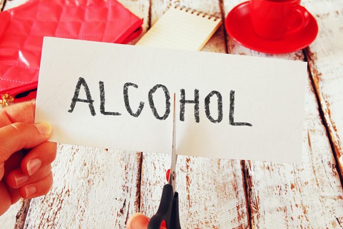 most harmful drug, cutting the word alcohol written on paper in half