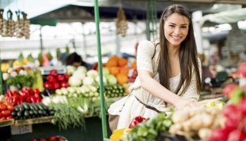 nutrition, Proper nutrition, beautiful smiling brunette woman in outdoor market