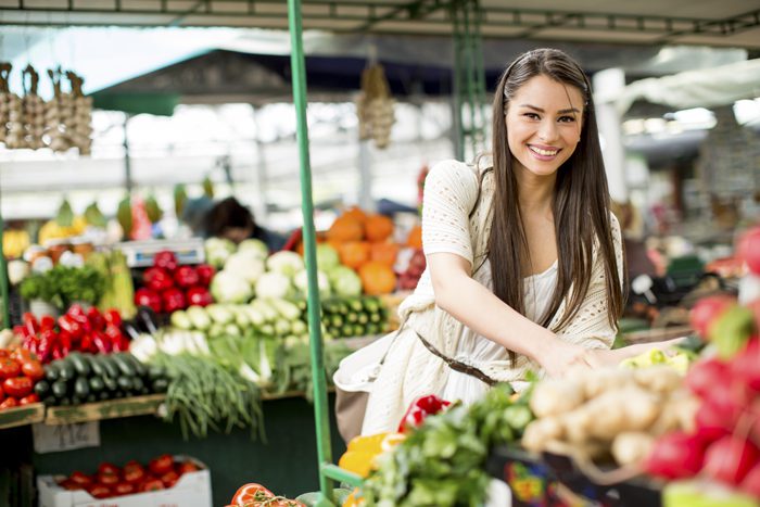 nutrition, Proper nutrition, beautiful smiling brunette woman in outdoor market