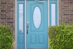 robin's egg blue front door to brick home