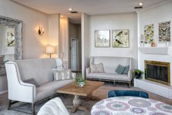 lovely room decorated in taupe and grey, with couches and a coffee table