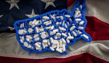 pills in shape of the United States on US flag - epidemic