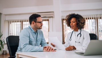 Inpatient Drug Rehab in Texas, man talking to female doctor - drug detox