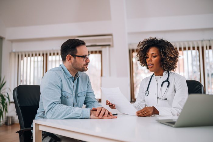 Inpatient Drug Rehab in Texas, man talking to female doctor - drug detox