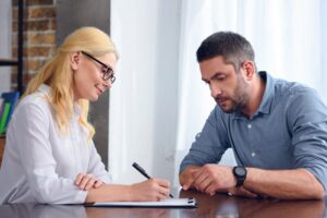 man working with female therapist - emotional support