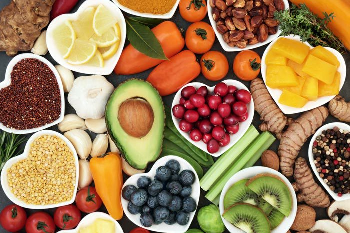 an array of healthy fruits, grains, nuts, and vegetables - nutritional