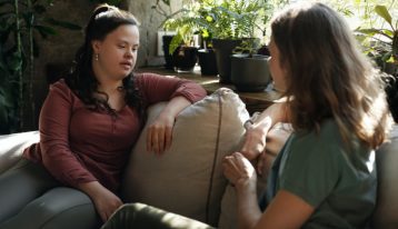 two woman talking on the couch - addiction treatment