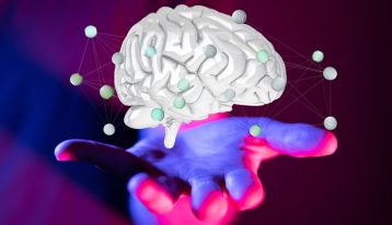 Symptoms of PCP addiction, PCP addiction, brightly colored illustration of a brain above a hand - PCP