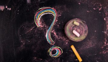 question mark written with colorful chalk - opioid overdose